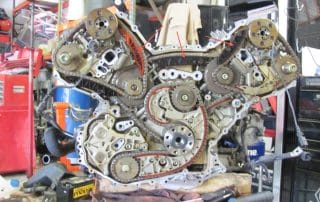 Exposed car engine with visible timing chains