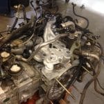Car engine with hoses in workshop