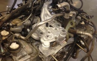 Car engine with hoses in workshop