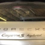 Rear view of dusty Porsche Cayenne S Hybrid