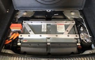 Hybrid car battery pack in trunk compartment