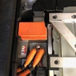 Electric vehicle battery compartment with high-voltage cables