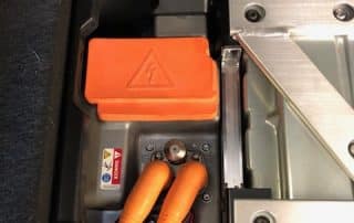 Electric vehicle battery compartment with high-voltage cables