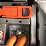 Close-up of industrial machine with orange cables