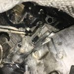 Close-up of car engine and transmission components