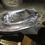 Damaged metal blade with visible wear and cracks