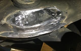 Damaged metal blade with visible wear and cracks