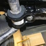 Close-up of car suspension component labeled Made in Germany
