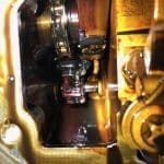 Close-up of engine timing chain and components
