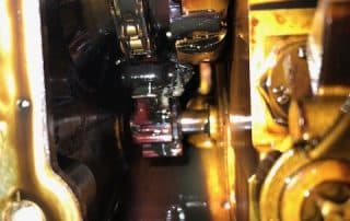 Close-up of engine timing chain and components