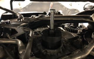 Automotive puller tool on engine component