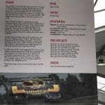 Porsche 917/30 museum display with race car photo