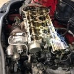 Car engine with exposed camshafts and turbocharger