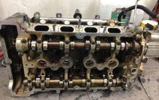 Exposed car engine cylinder head with camshafts