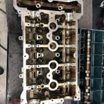 Engine cylinder head with camshafts on workbench