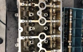 Engine cylinder head with camshafts on workbench