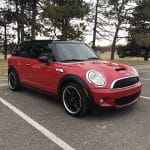 Red Mini Cooper parked in empty lot