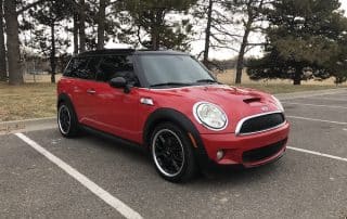 Red Mini Cooper parked in empty lot