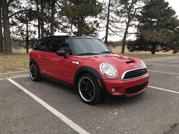 Red Mini Cooper parked in empty lot