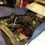 Car engine bay with engine removed