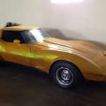 Gold classic Chevrolet Corvette Stingray in garage
