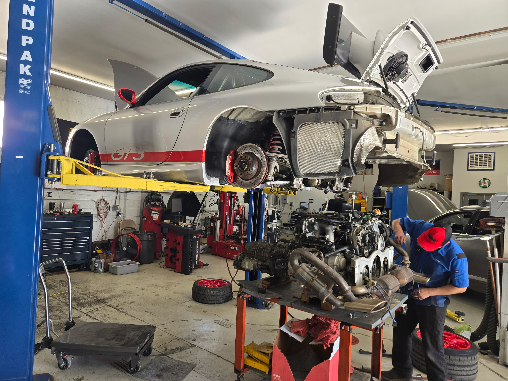 Porsche 911 GT3 on lift during engine service