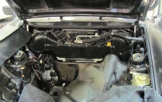 Car engine bay with hood open
