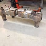 Large diesel exhaust system on workshop floor