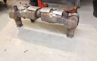 Large diesel exhaust system on workshop floor