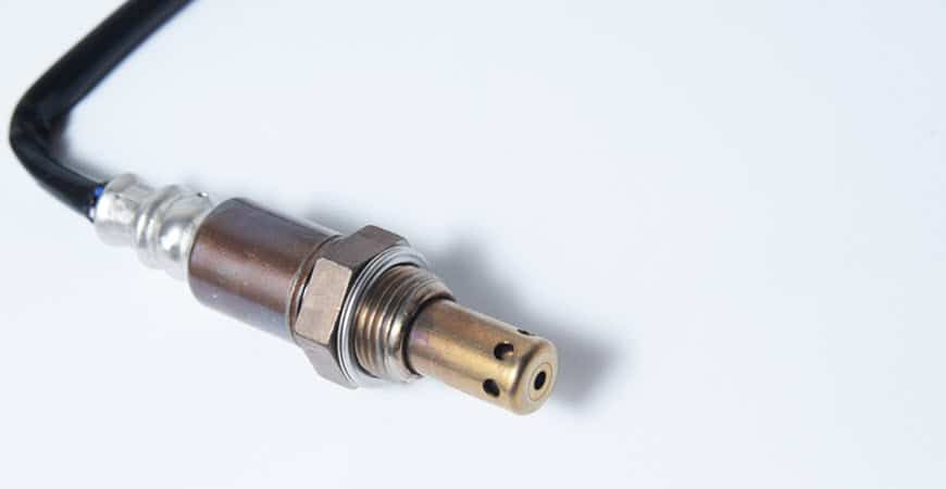 Close-up of automotive oxygen sensor with wire