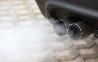 Car exhaust pipes emitting white smoke