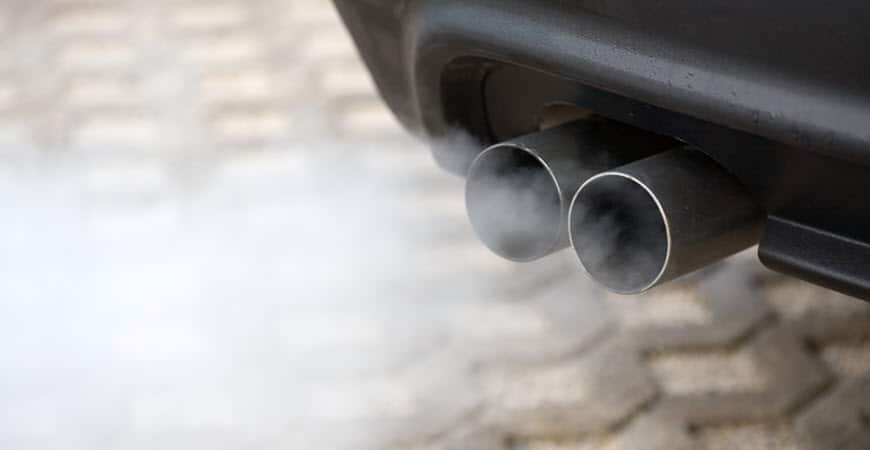 Car exhaust pipes emitting white smoke