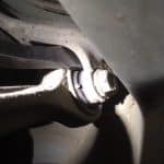 Close-up of car suspension bolt and control arm