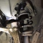 Car suspension with coil spring and control arm