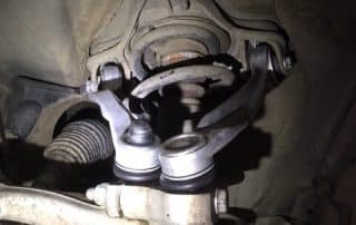 Close-up of car suspension and ball joint assembly