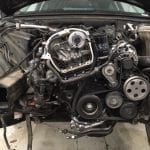 Car engine with exposed timing components and belts