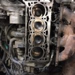 Car engine block with exposed cylinders