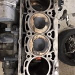 Car engine block with exposed pistons