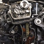 Exposed car engine with visible timing chain components