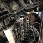 Car engine with exposed camshaft and timing components