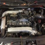 Car engine bay with turbo and intake system