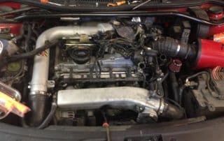 Car engine bay with turbo and intake system