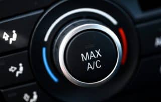 Car climate control knob set to Max A/C