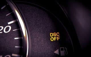Car dashboard showing DSC OFF warning light