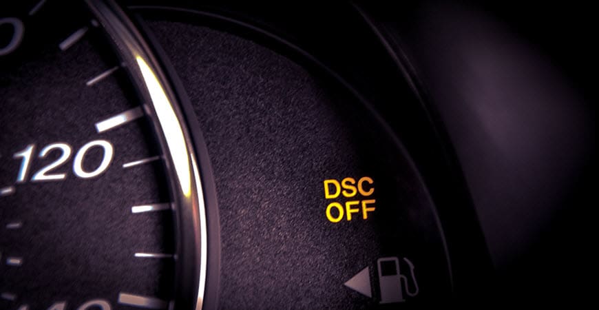 Car dashboard showing DSC OFF warning light