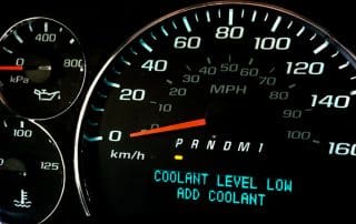 Car dashboard warning: coolant level low