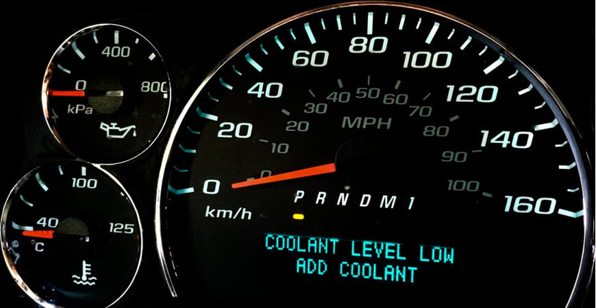 Car dashboard warning: coolant level low