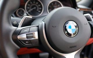 BMW steering wheel and dashboard interior close-up