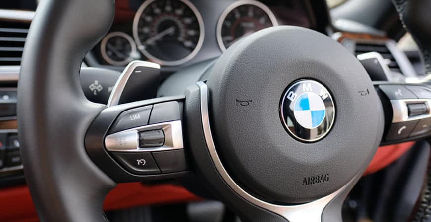 BMW steering wheel and dashboard interior close-up