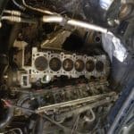 Exposed inline six-cylinder engine block in car